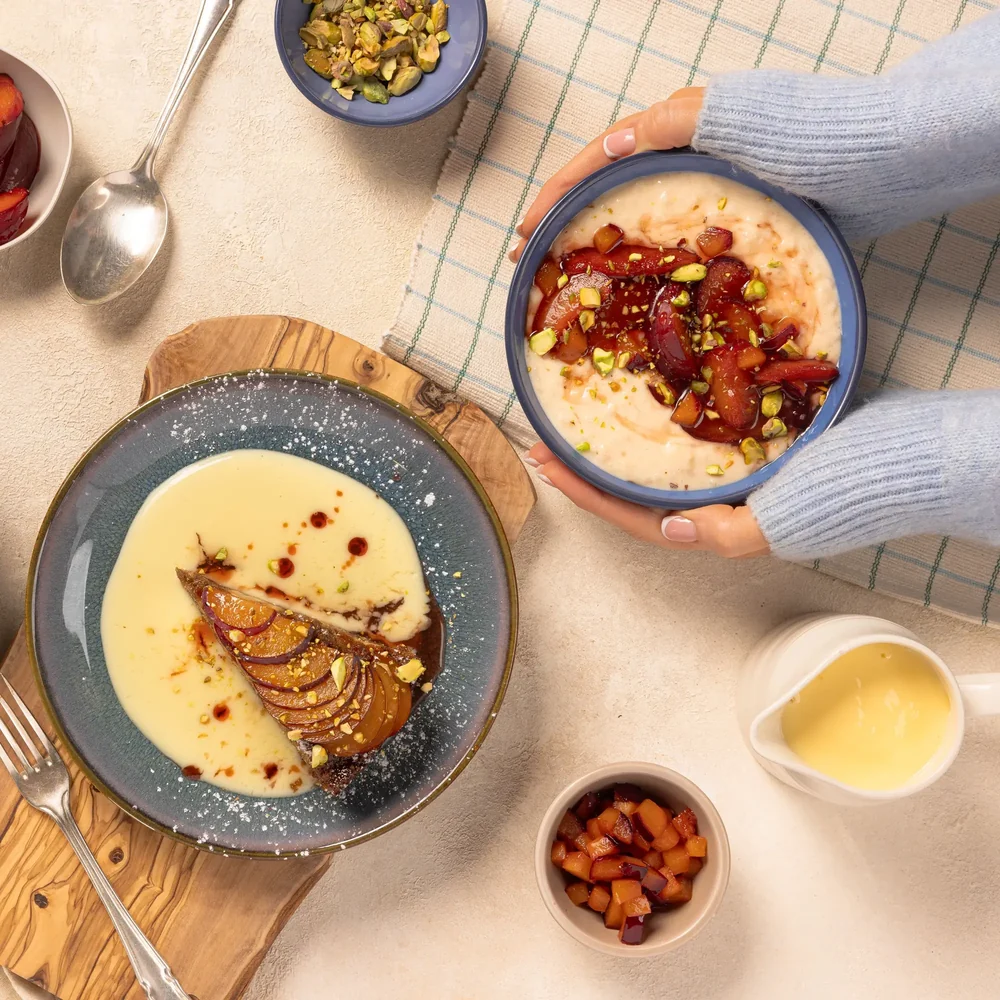 Plum cake with custard and rice pudding with roasted plums, styled for Avonmore